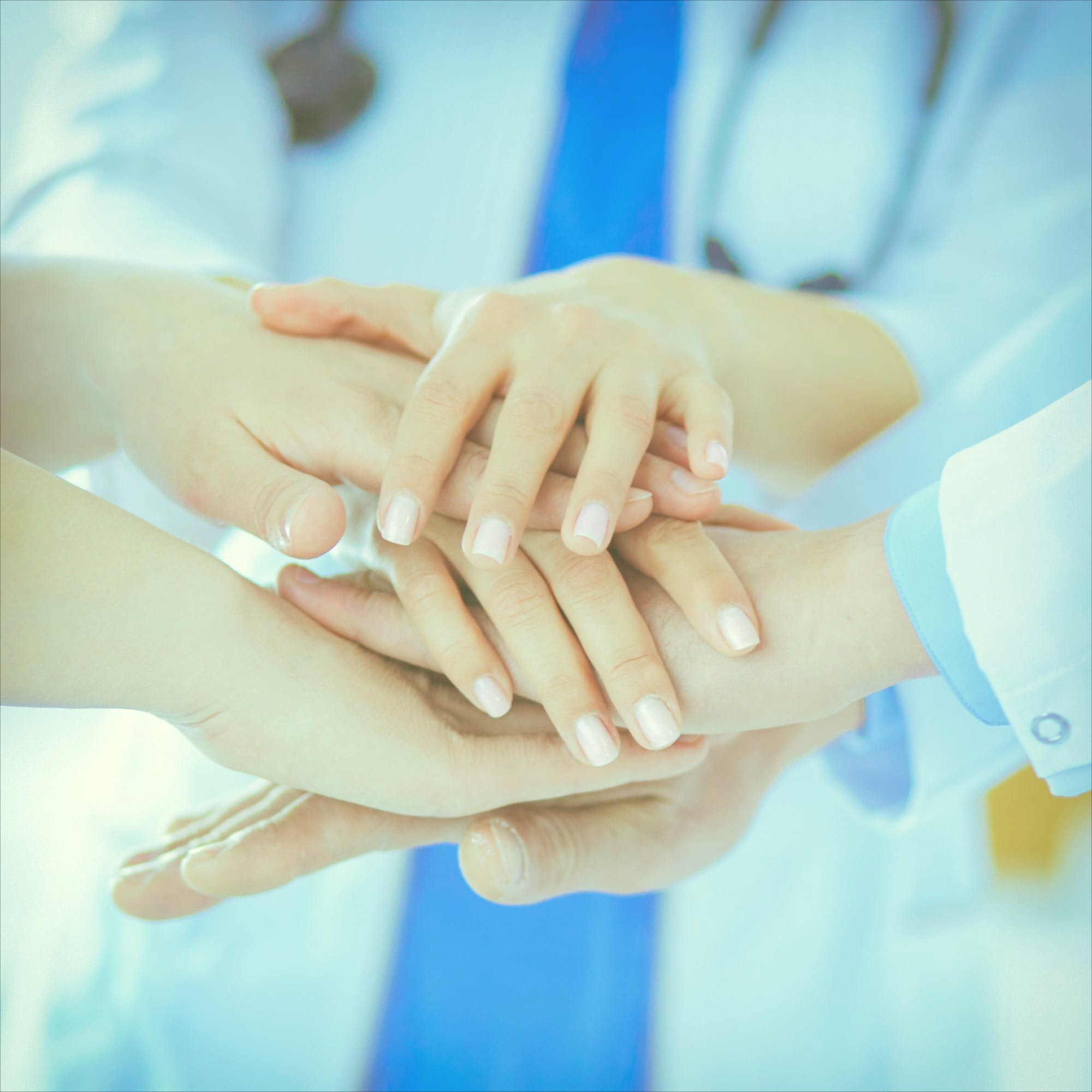 Healthcare team collaboration - hands together